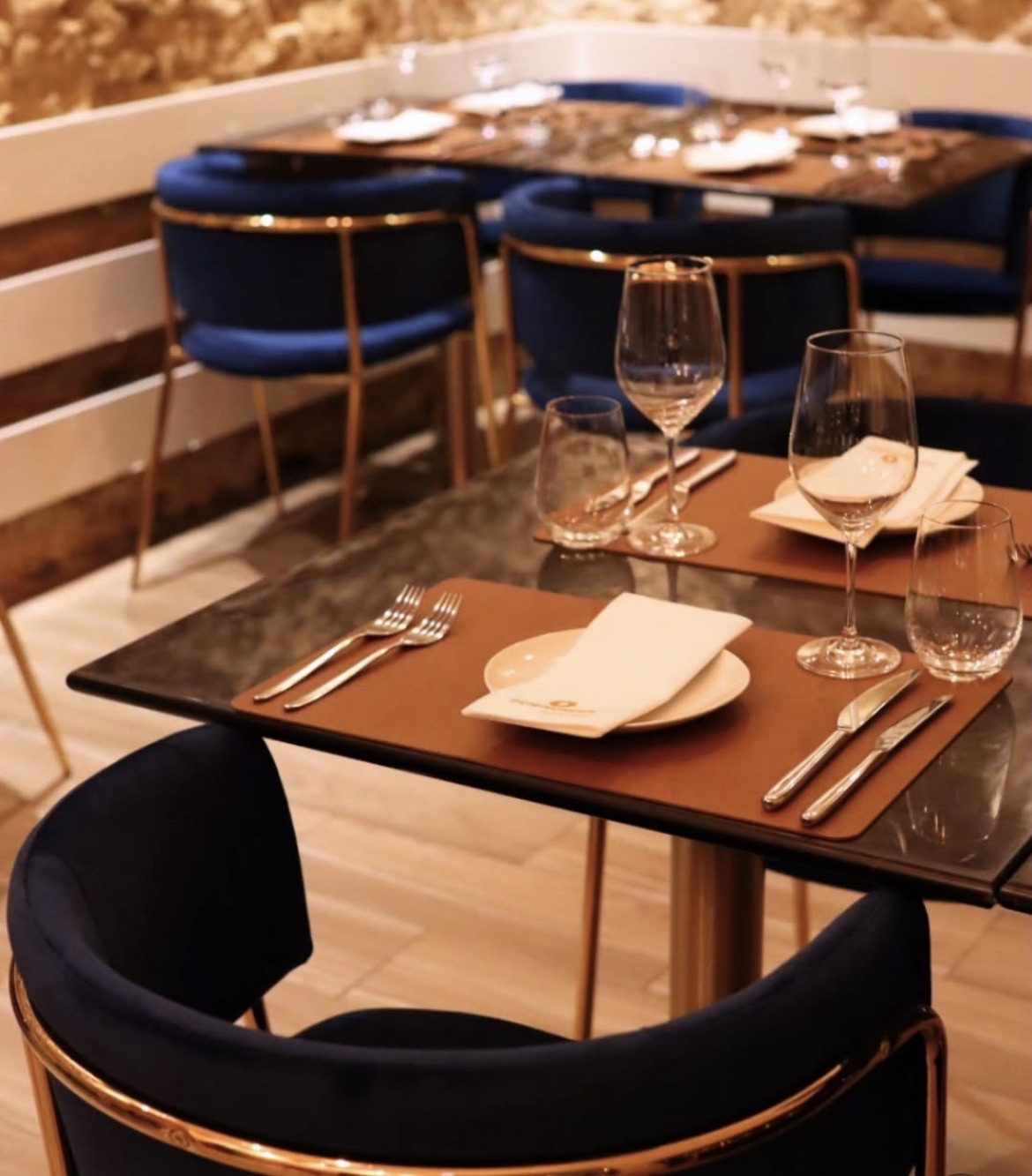 Private dining at home table setting in Lisbon with elegant plating and candlelight